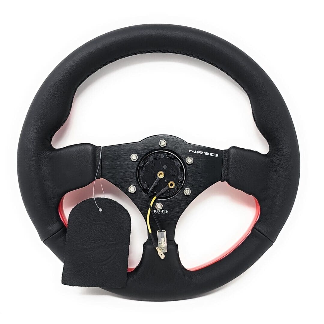 Black gaming steering wheel with paddle shifters and buttons.