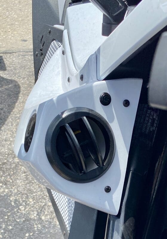 Close-up of a car's fuel cap and surrounding area.