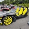 A black and yellow vehicle with four seats