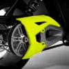 Close-up of a motorcycle's rear wheel with a bright yellow chain guard.