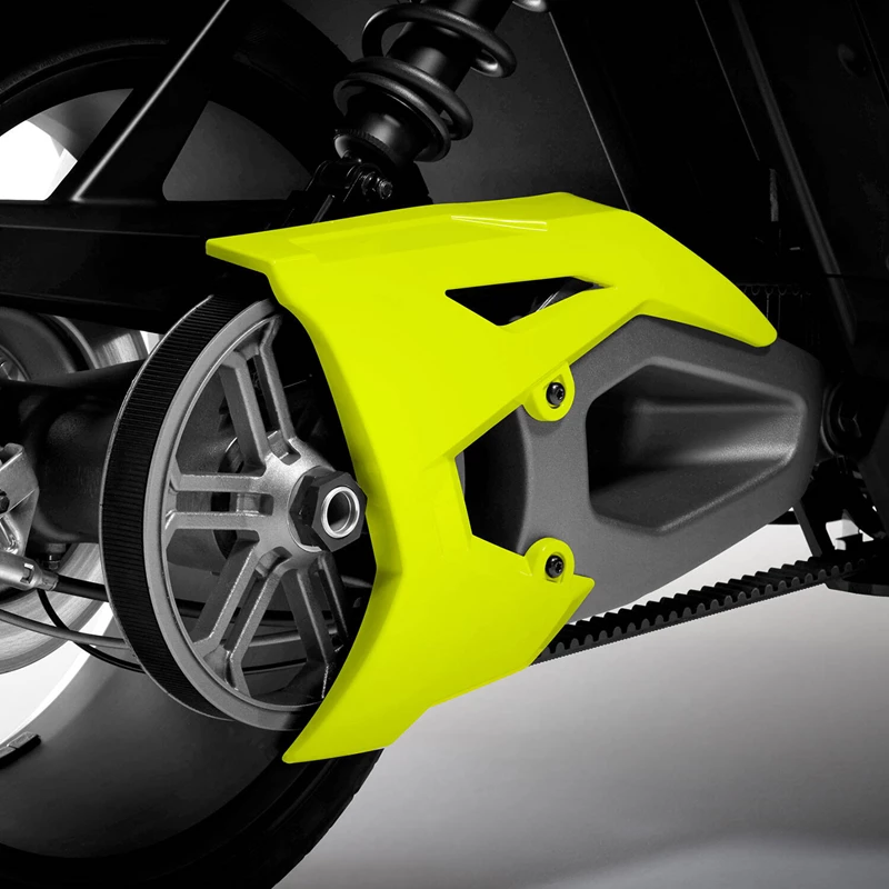 Close-up of a motorcycle's rear wheel with a bright yellow chain guard.