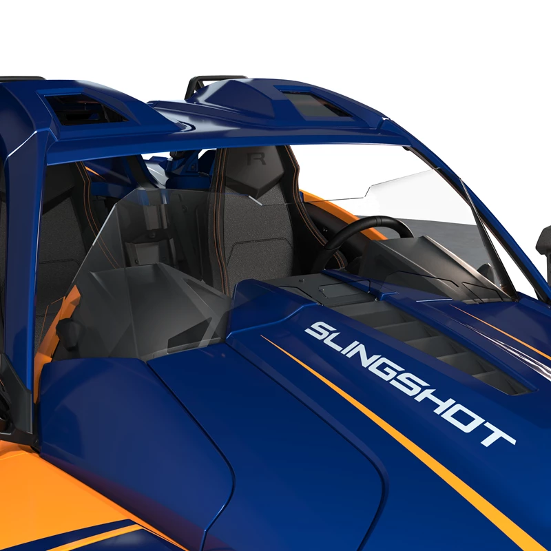 A close-up of a blue and orange Slingshot vehicle interior with bucket seats.