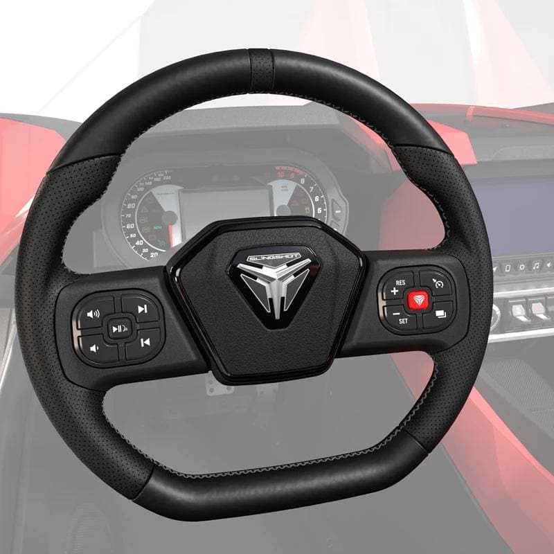 Close-up of a modern car steering wheel with control buttons.