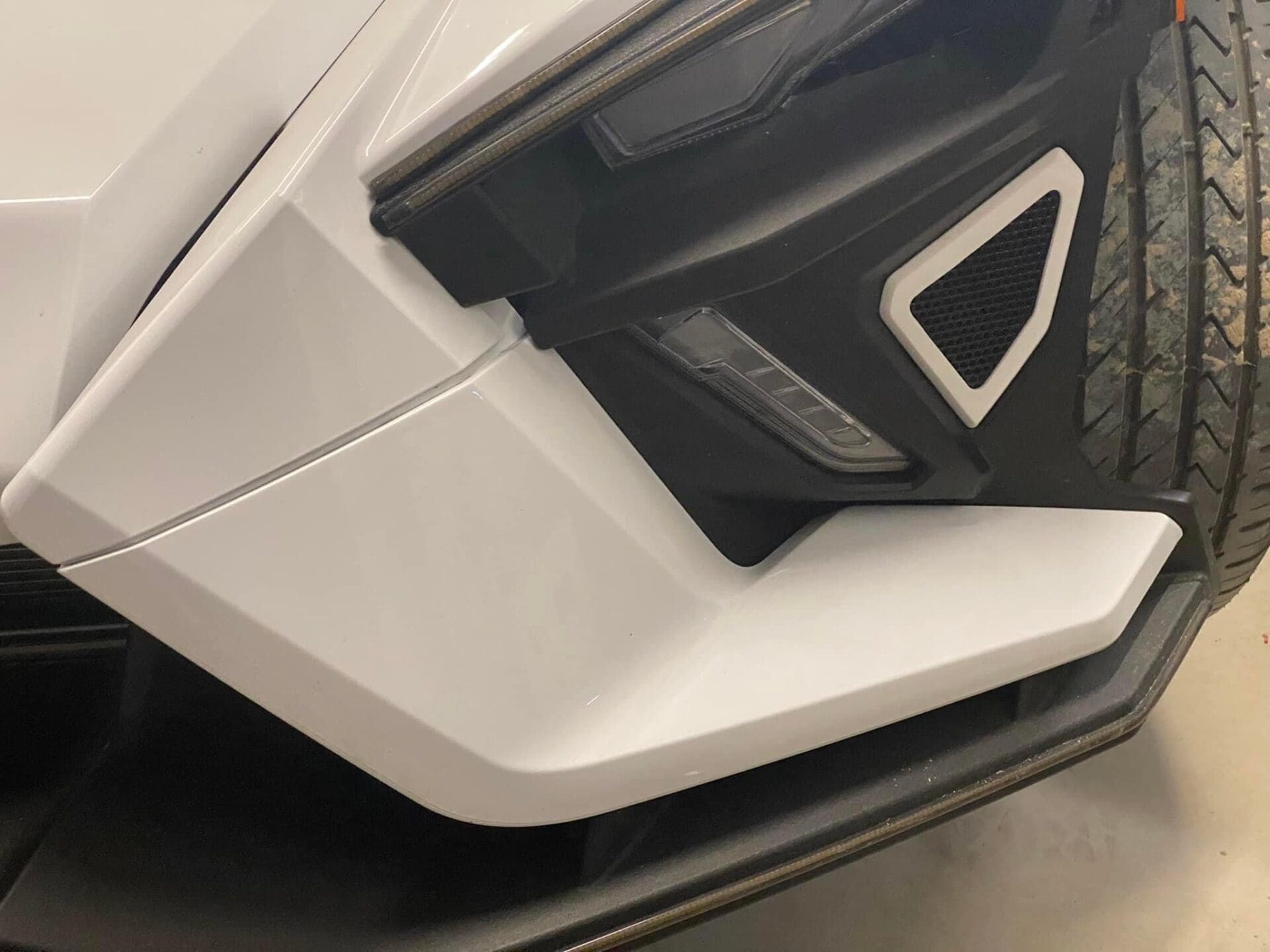 Close-up of a black and white object with angular design features.