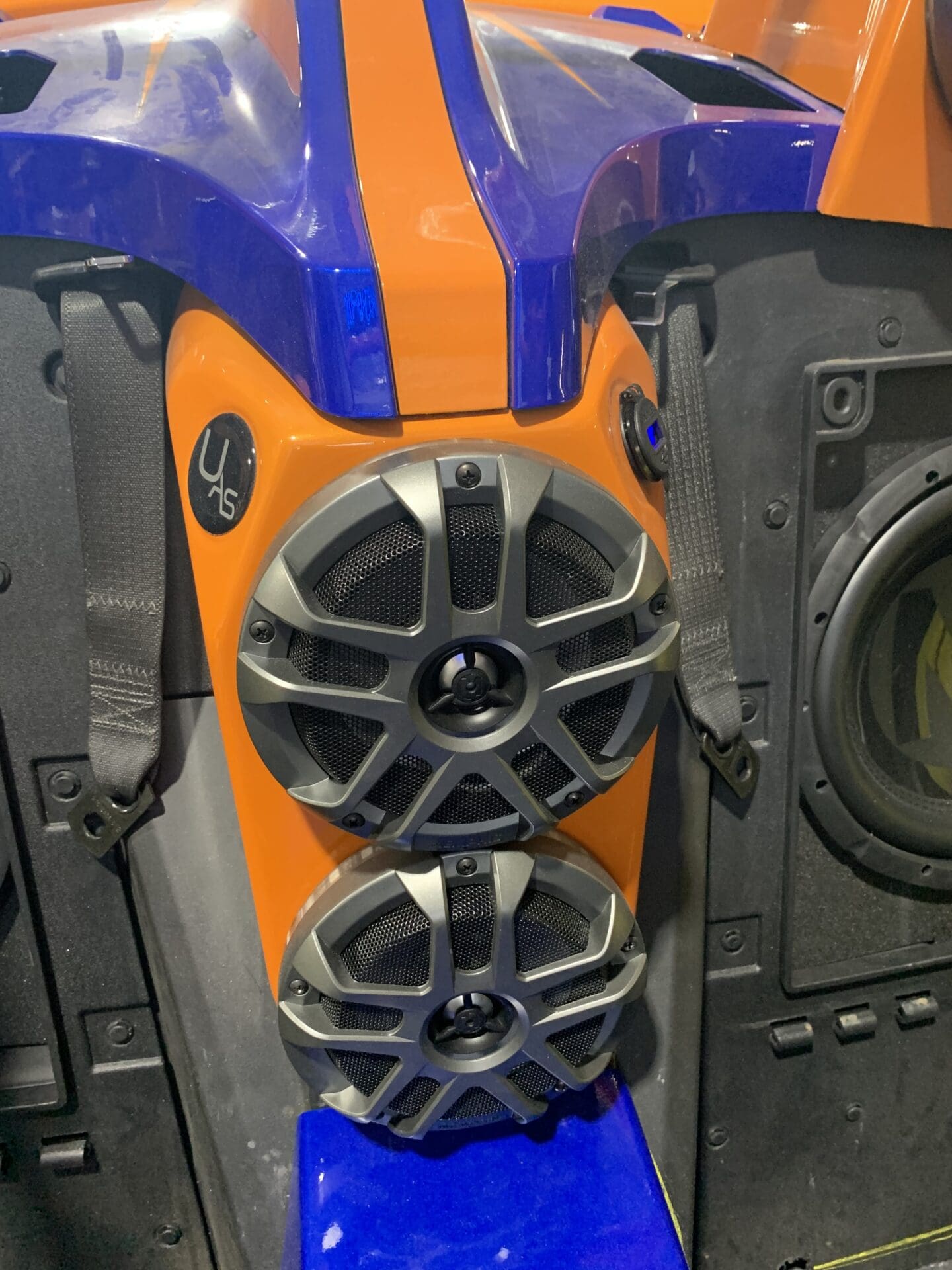 Blue and orange mount with speakers