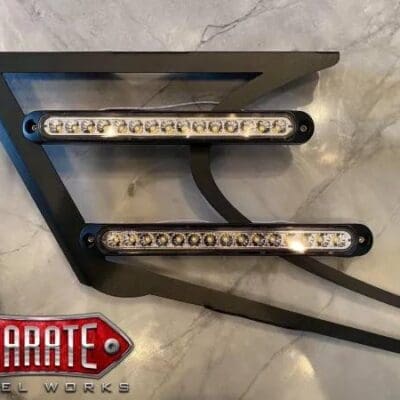 A black metal part with lights