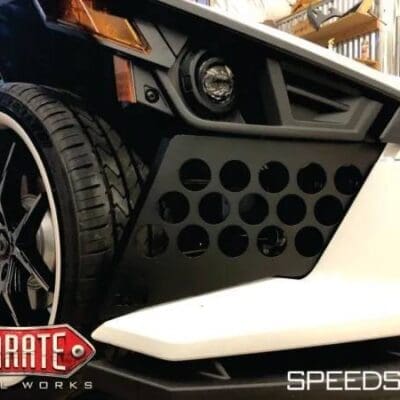 A white bumper and black metal part with holes