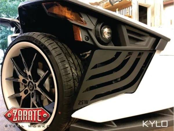 Closeup photo of a white bumper and tire