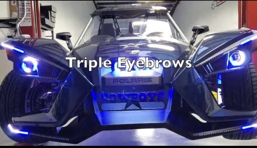 A car with three windshield wipers labeled 'Triple Eyebrows'.