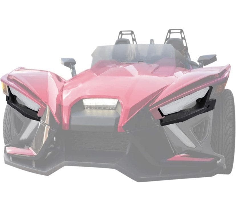 Front view of a sleek red sports car with sharp headlights.