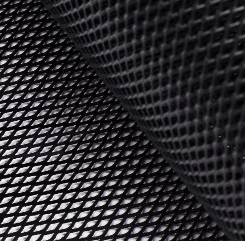 Close-up of textured black mesh fabric with diamond pattern.