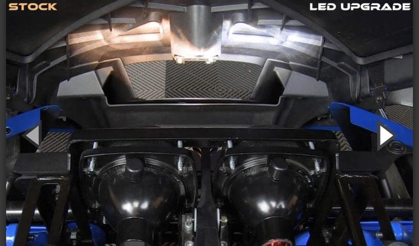 Close-up of a car's dual exhaust system with polished pipes.