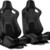 Two black racing bucket seats with side bolsters and harness slots.