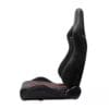 Black ergonomic gaming chair with red accents and high backrest.