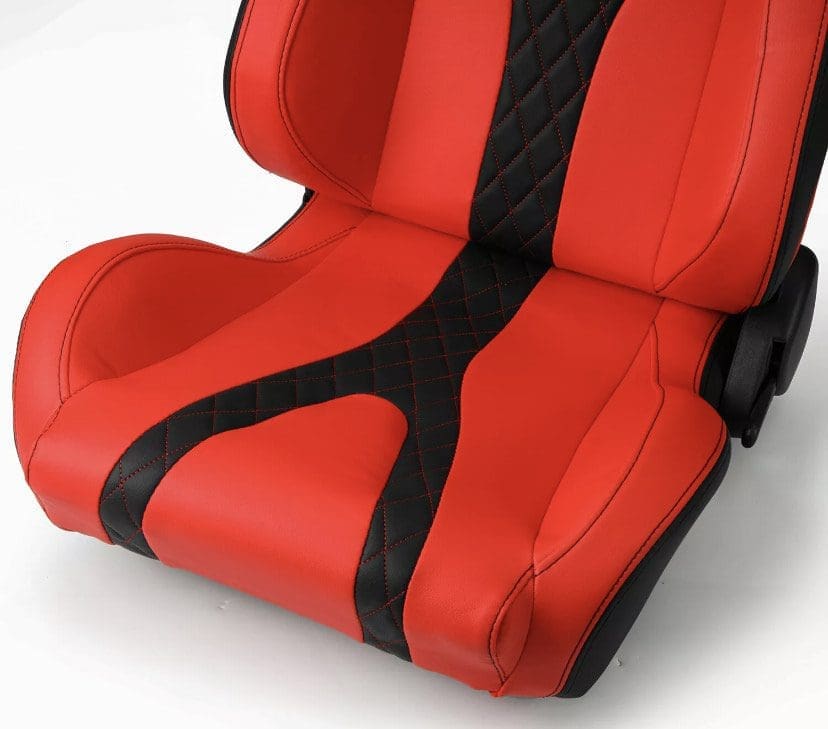 Red and black racing-style car seat with diamond stitching.