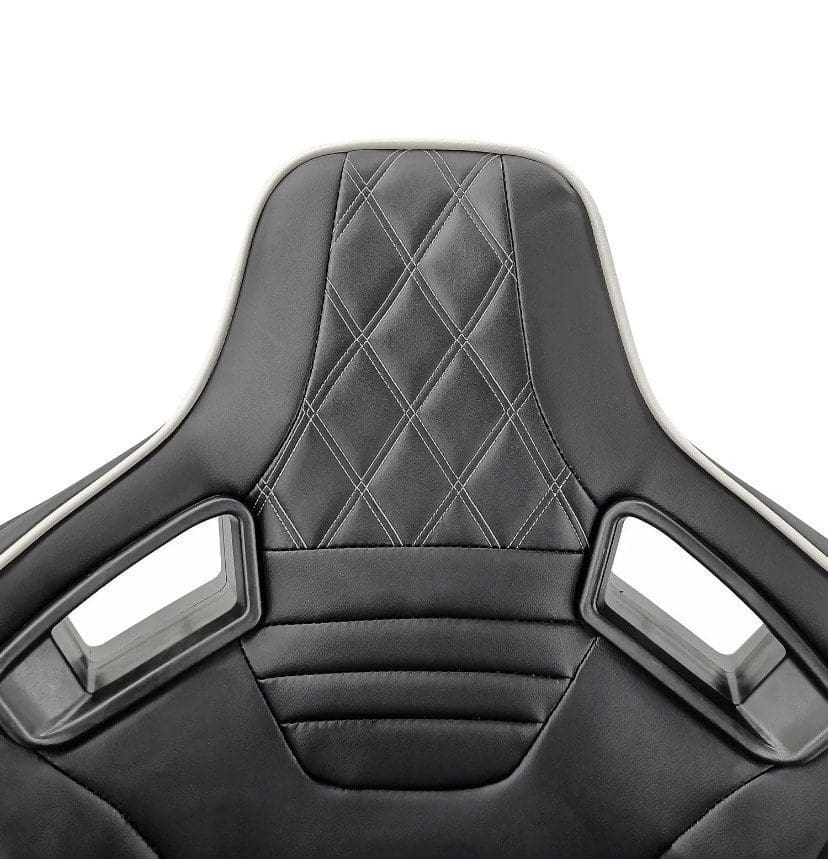 IMG_4968 Black ergonomic gaming chair with diamond stitching and cut-out handles.