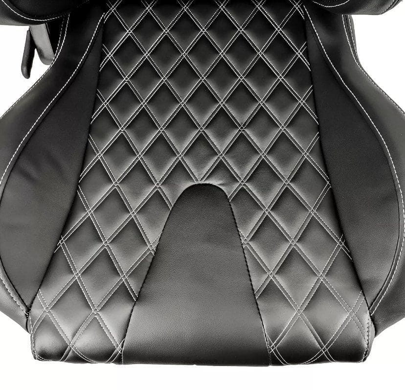 IMG_4970 Close-up of a black quilted car seat cover with diamond stitching.