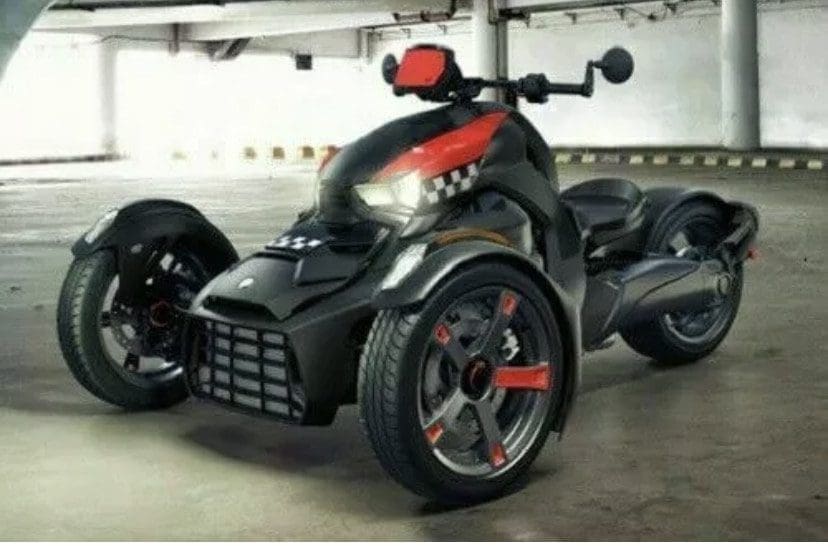 A sleek black three-wheeled motorcycle with red accents and a shark-face design.