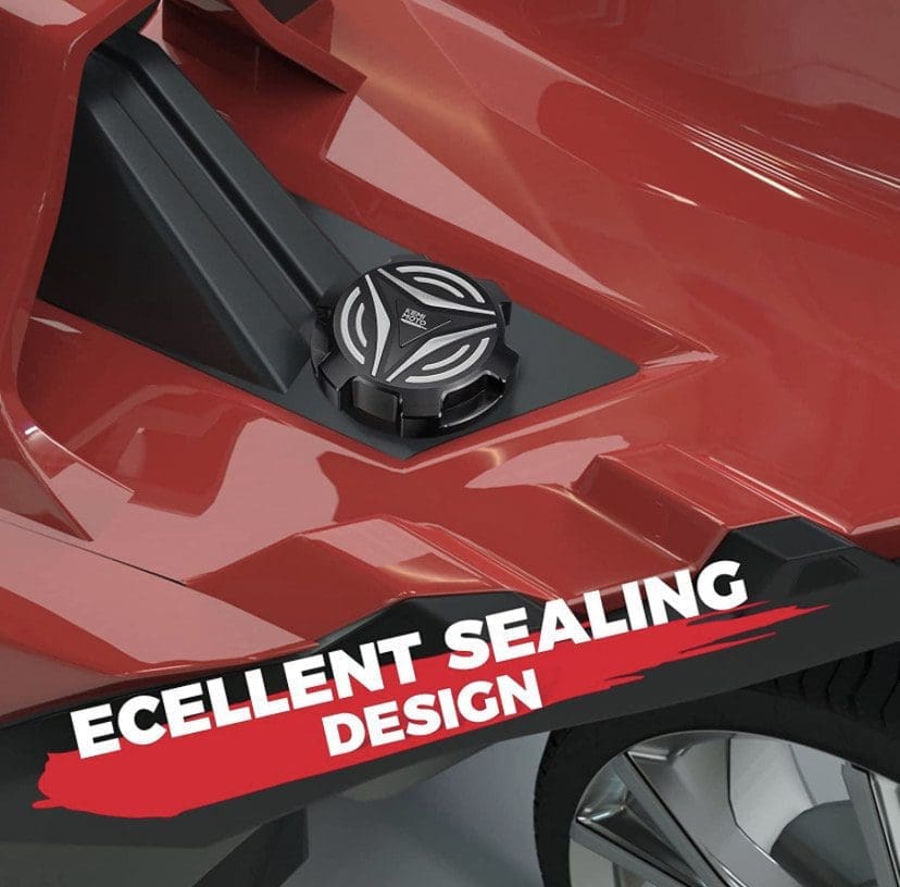 Close-up of a black fuel cap on a red vehicle with text about sealing design.