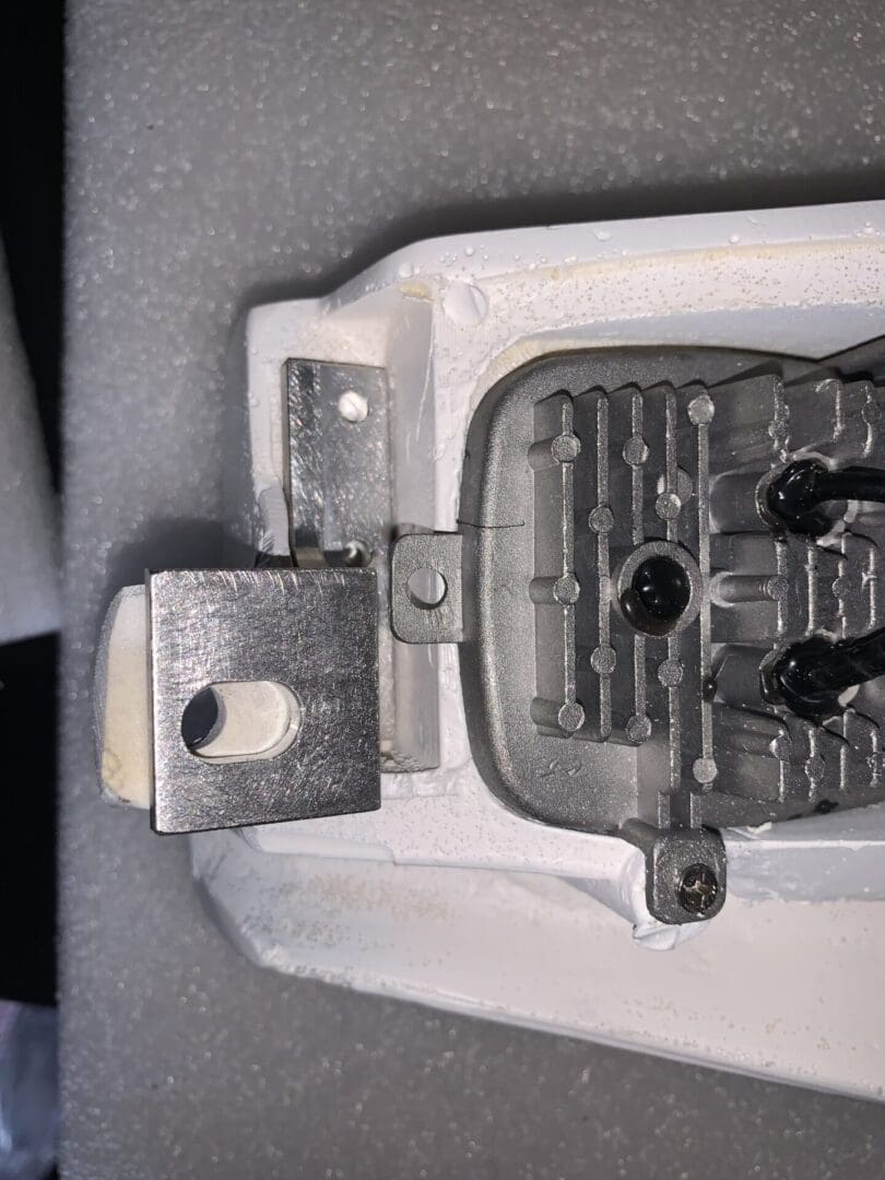 Close-up of a metal padlock shackle and locking mechanism.