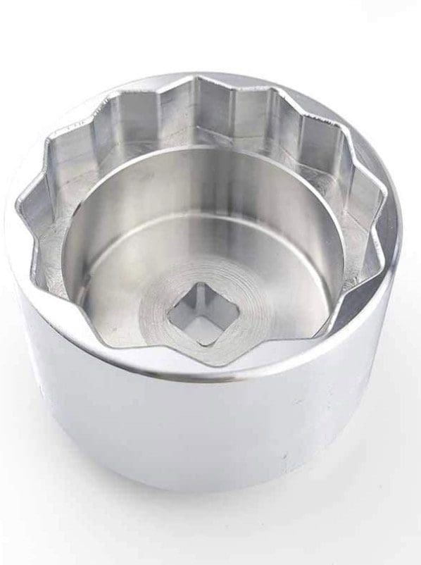 Metal socket wrench tool with 12-point star shape.
