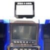 Close-up of a blue arcade machine's control panel and screen.