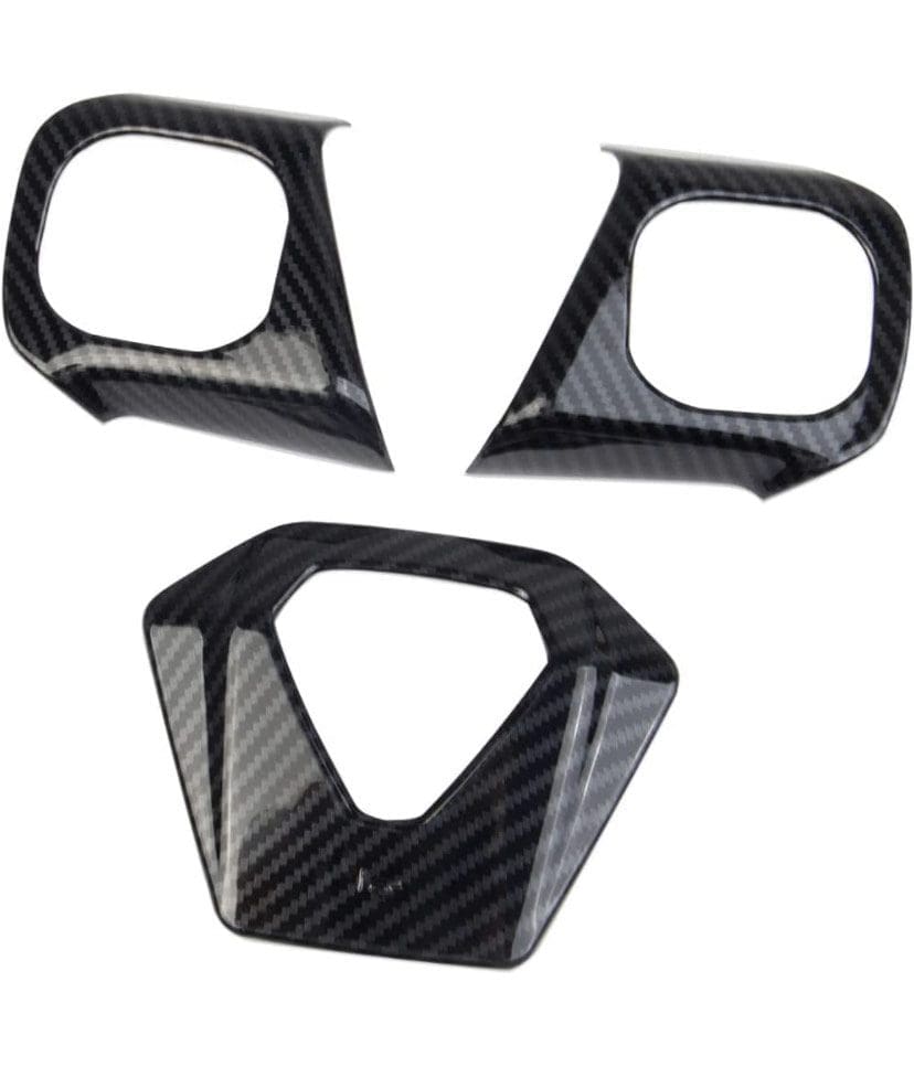 Set of carbon fiber car mirror and interior trim covers.