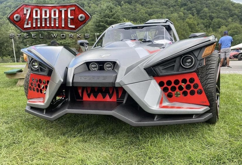 A custom Polaris vehicle with aggressive design and Zarate Steel Works branding.