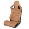 Tan racing car seat with black base and harness slots.