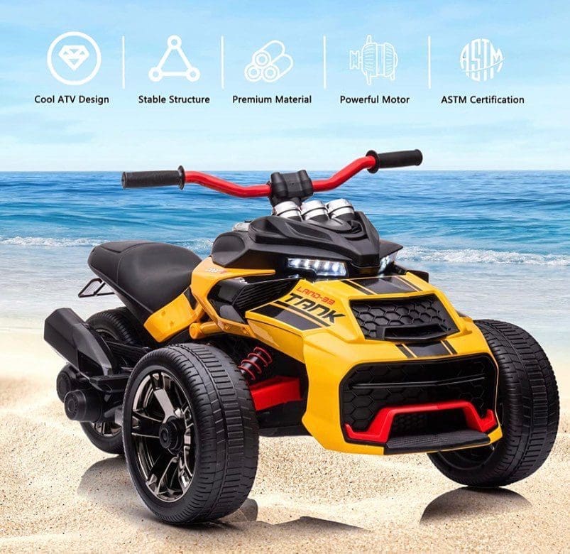 Yellow all-terrain remote-controlled vehicle on a sandy beach.