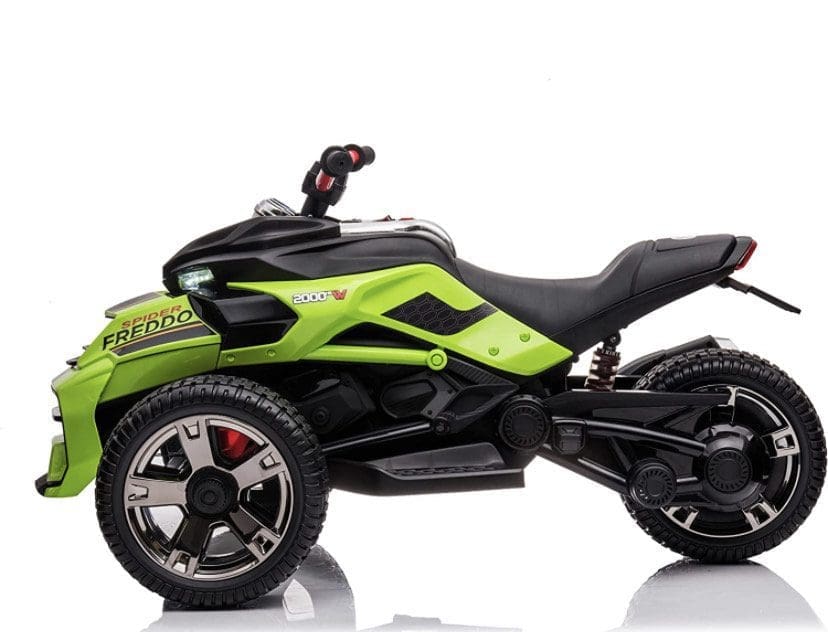 A sleek black and green three-wheeled electric ride-on toy for kids.