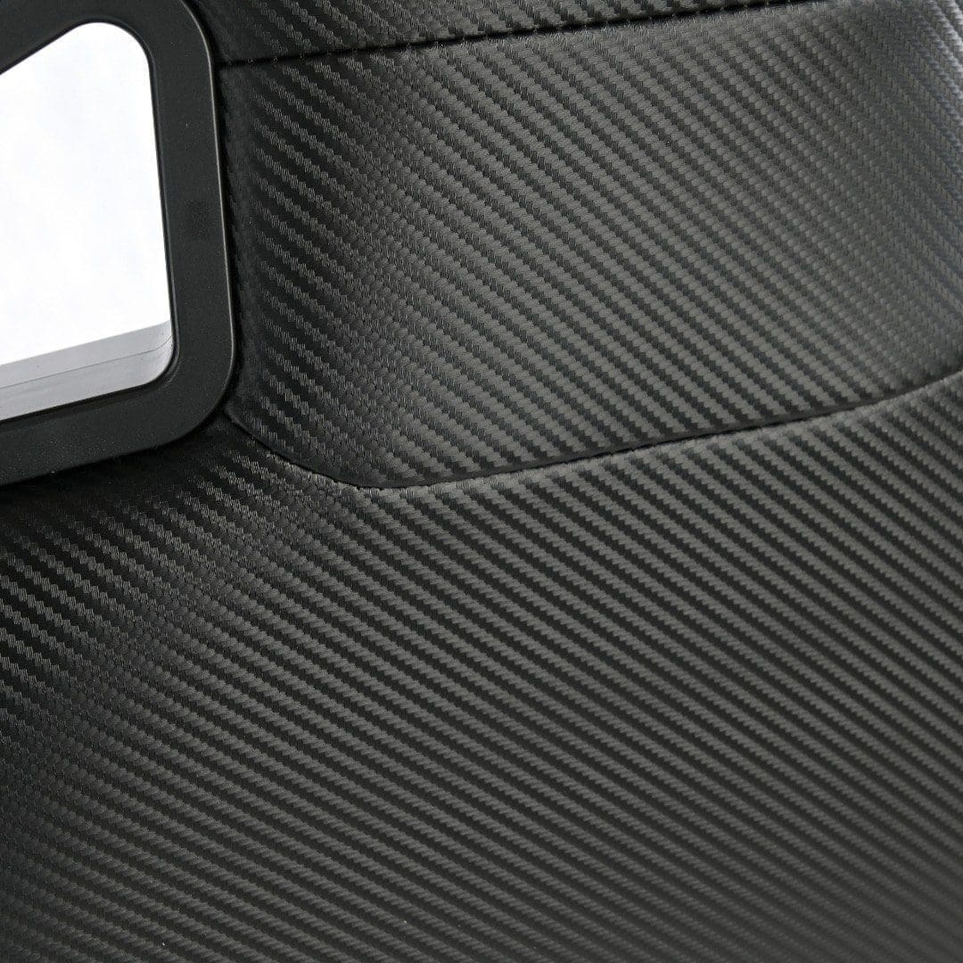 Close-up of textured black fabric with a white label.