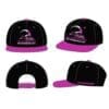 Black and purple snapback cap with a logo on the front panel.