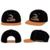 Black and orange baseball caps with a logo on the front.