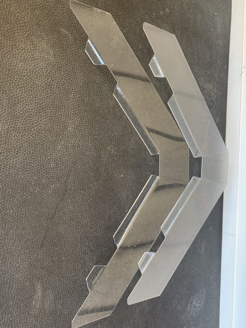 Modern staircase with glass panels and metal railings in a bright interior.