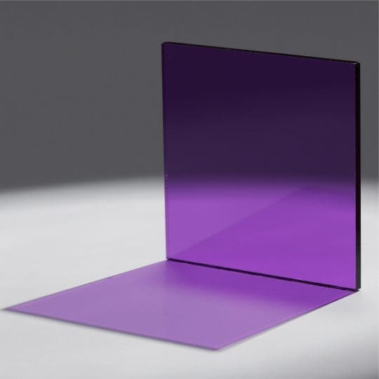 A purple acrylic sheet casting a shadow on a white surface.