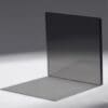 A thin, dark, transparent square casting a shadow.
