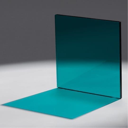 Minimalist turquoise panels casting shadows on a gray surface.