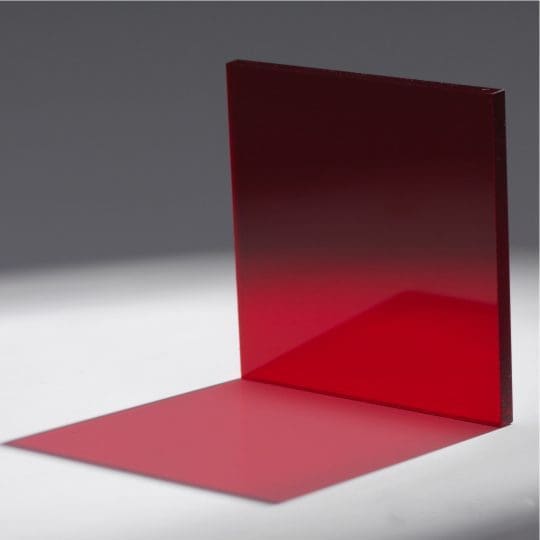 A red transparent panel casting a colored shadow on a gray surface.