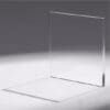 A transparent glass panel casting a shadow on a gray surface.