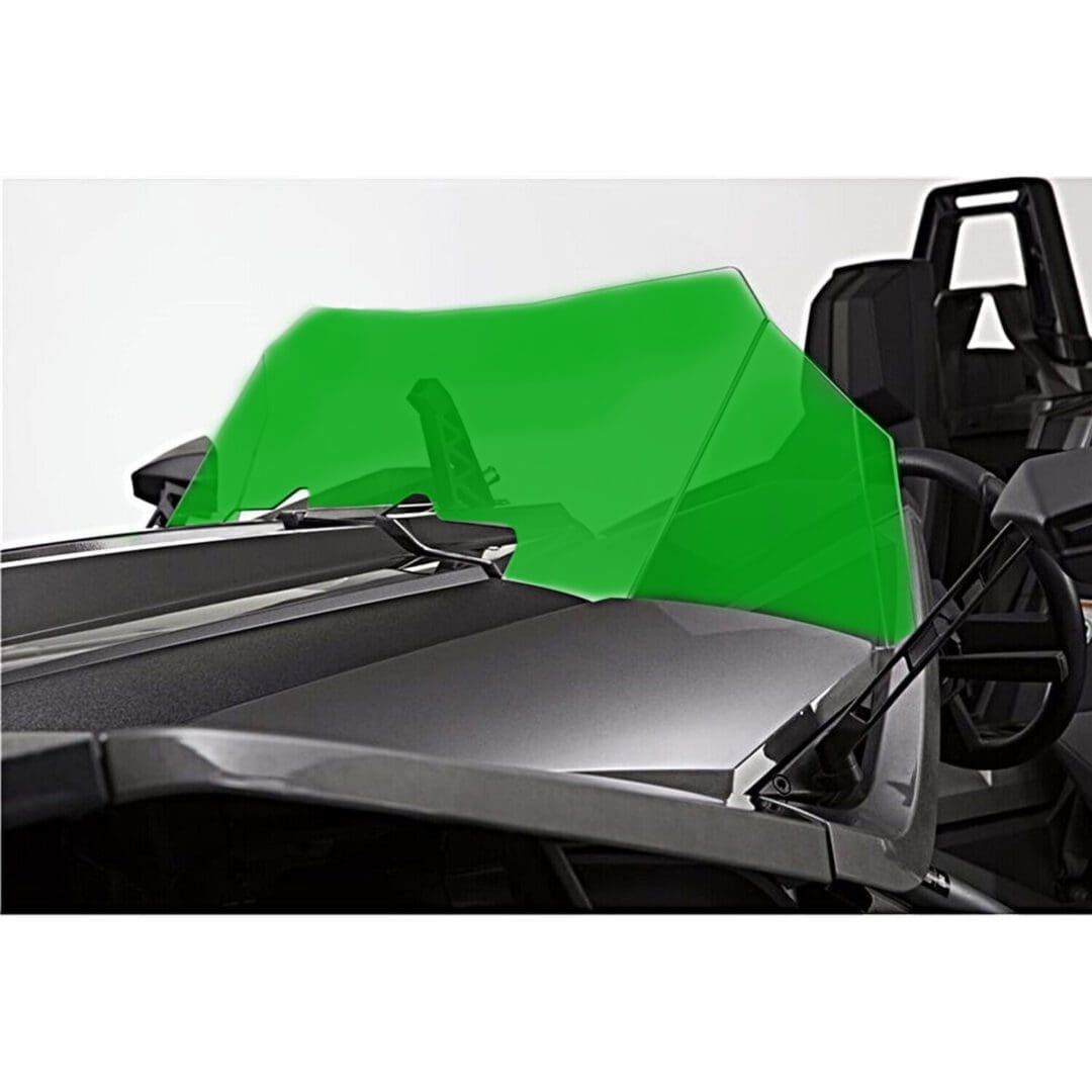 Green racing car windshield with sleek black body.