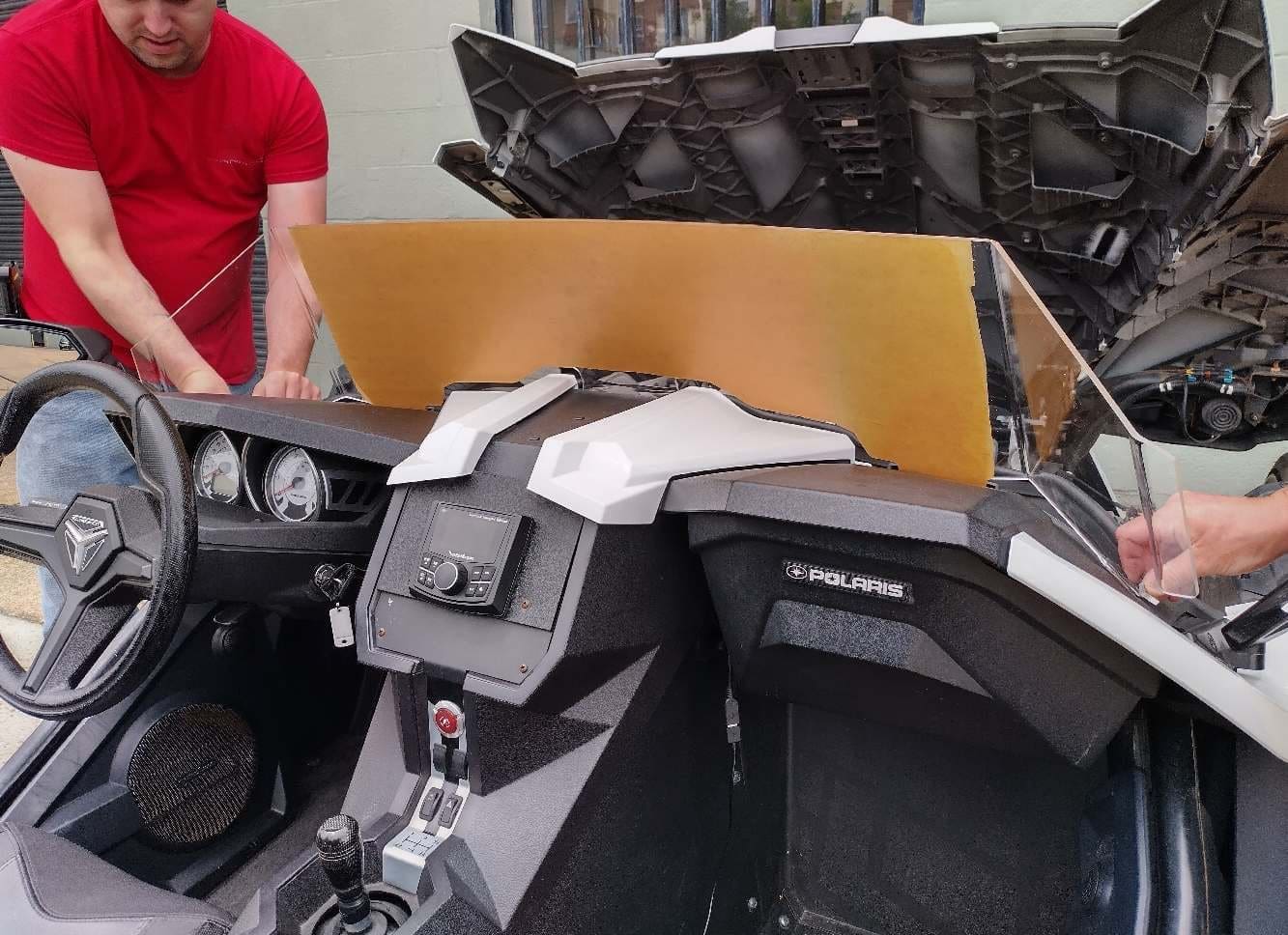 Cockpit interior of a futuristic vehicle with advanced controls and displays.