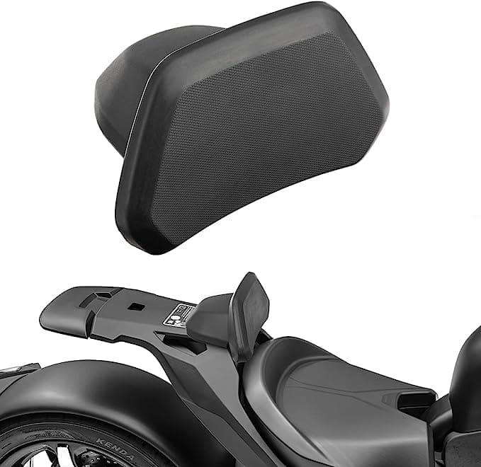 Motorcycle backrest attached to the rear seat for rider comfort.
