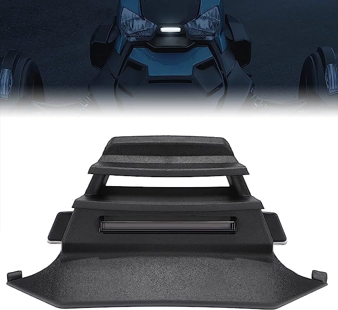 Black plastic parts displayed in a staggered arrangement on a dark background.