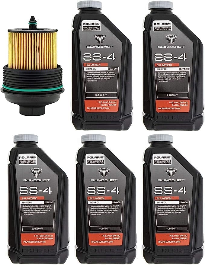 Set of motor oil and fuel filters with containers on white background.