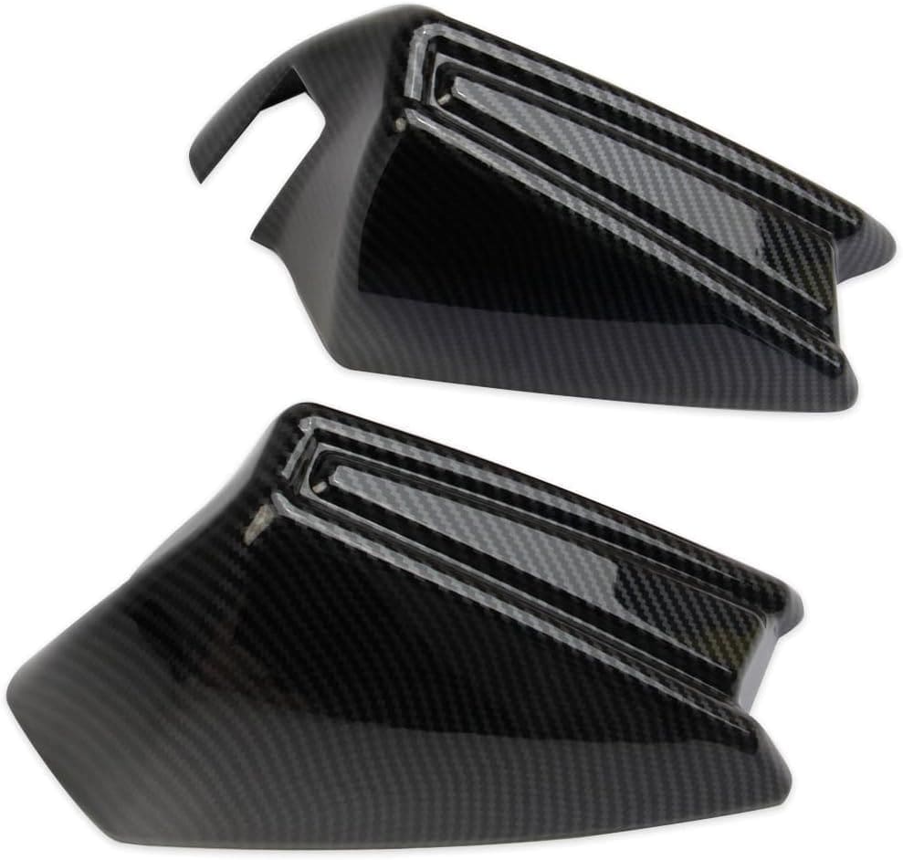 Two black carbon fiber car accessories with a sleek design.
