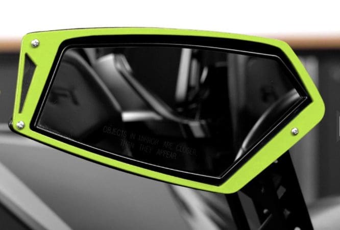 Close-up of a sleek green and black electric scooter's handle and display.