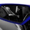 Close-up of a sleek blue car side mirror reflecting the interior.