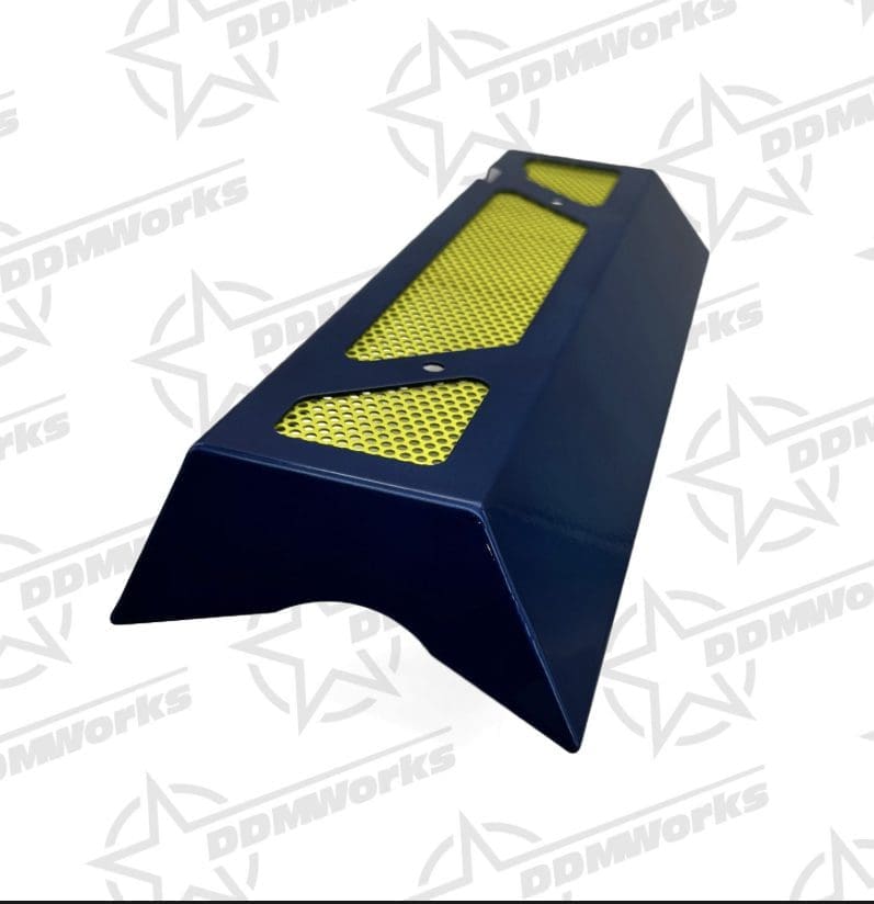 Black parking speed bump with yellow reflective patches.