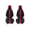 Two black and red car seat covers with sporty design.